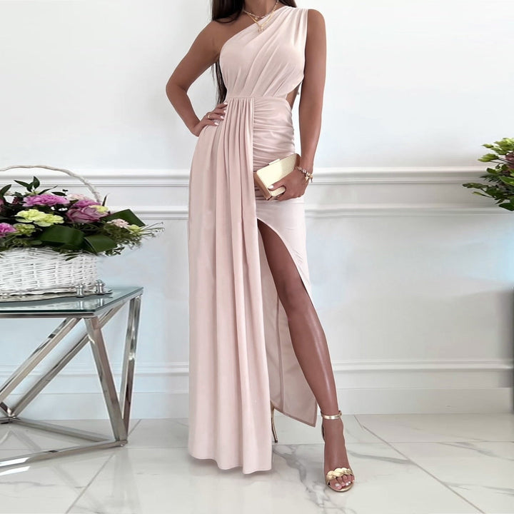 Blush pink women's one shoulder maxi evening gown, featuring a draped waist and leg split. Ideal for formal events.
