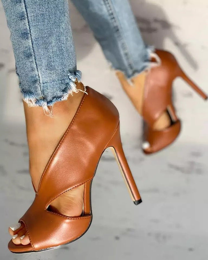 Elegant women's open-toe cutout stiletto heels, perfect for dressy occasions and parties.