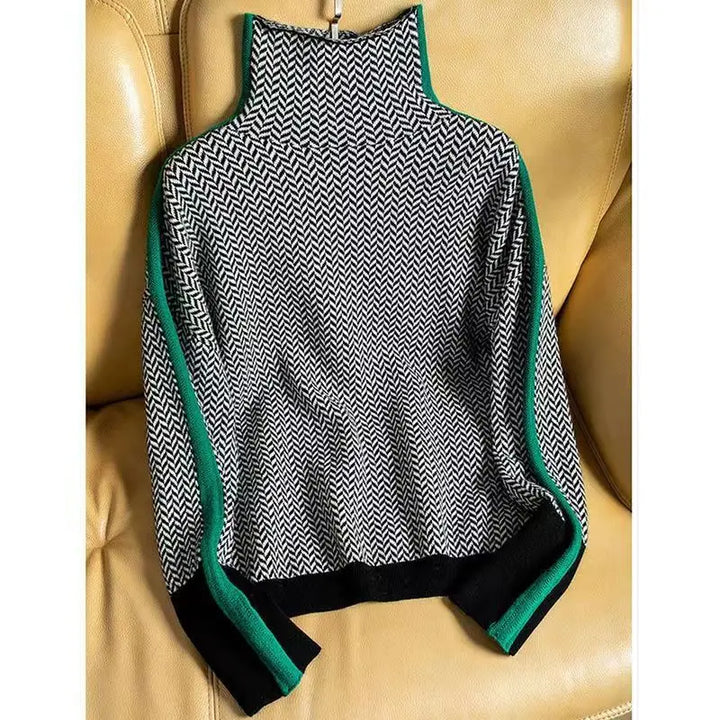 Close-up of women's green herringbone turtleneck sweater, highlighting knit pattern and elegant texture