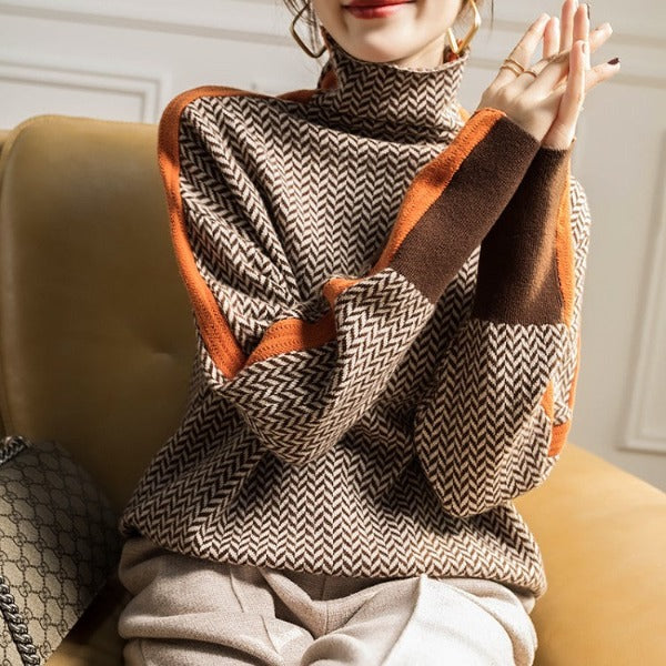 Full shot of model wearing women's green herringbone turtleneck sweater, showcasing elegant long sleeve design