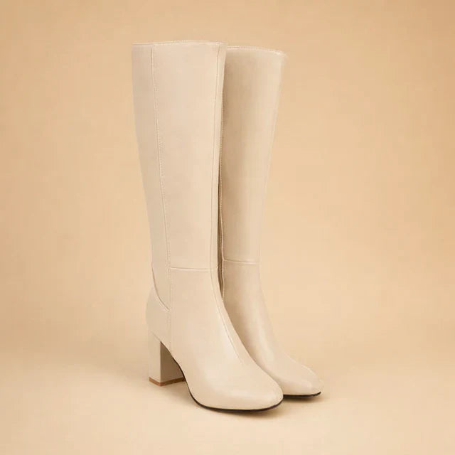 Chic brown over-the-knee high heel boots for women. Elegant fashion winter boots with a sleek design.