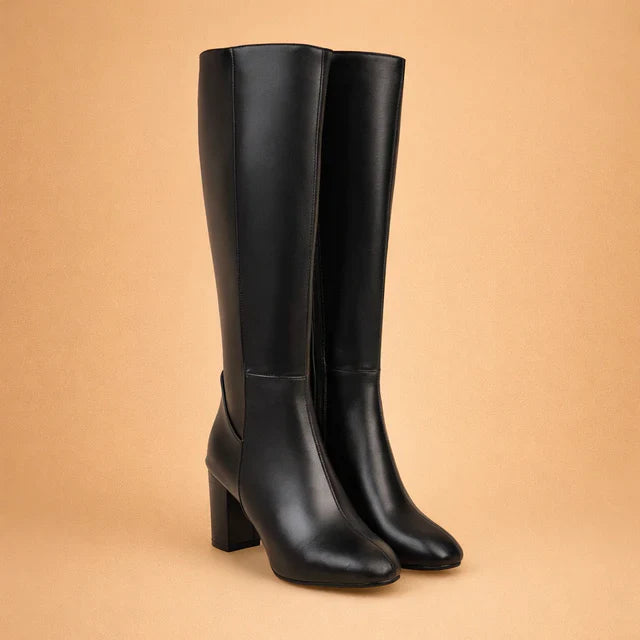 Stylish black over-the-knee high heel boots for women. Elegant winter fashion, perfect for a chic look.