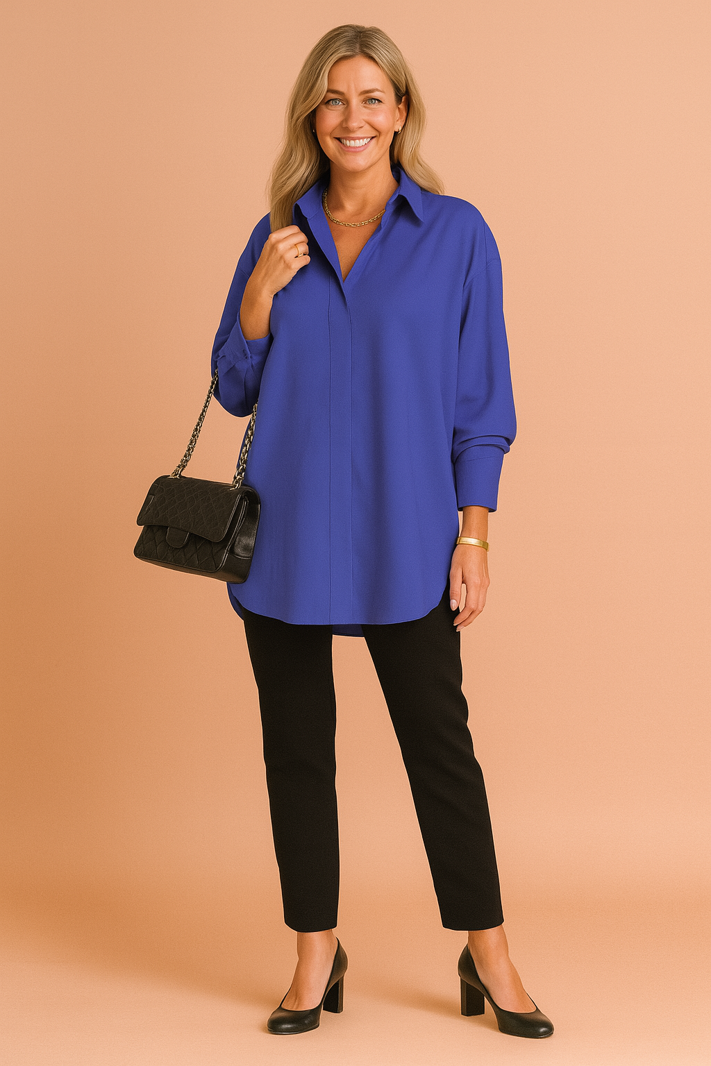 Casual chic women's oversized blouse. A comfortable, modern long-sleeve shirt with button-up detail for women's fashion.