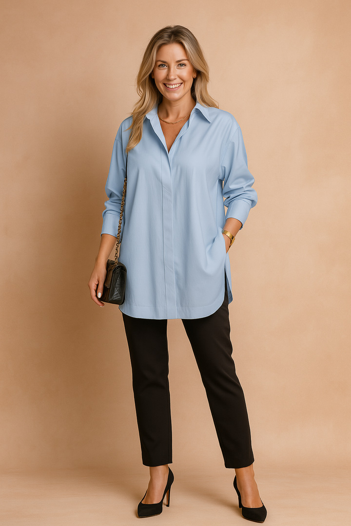 Sophisticated women's oversized blouse. Elegant long-sleeve workwear shirt, a modern and comfortable versatile top.