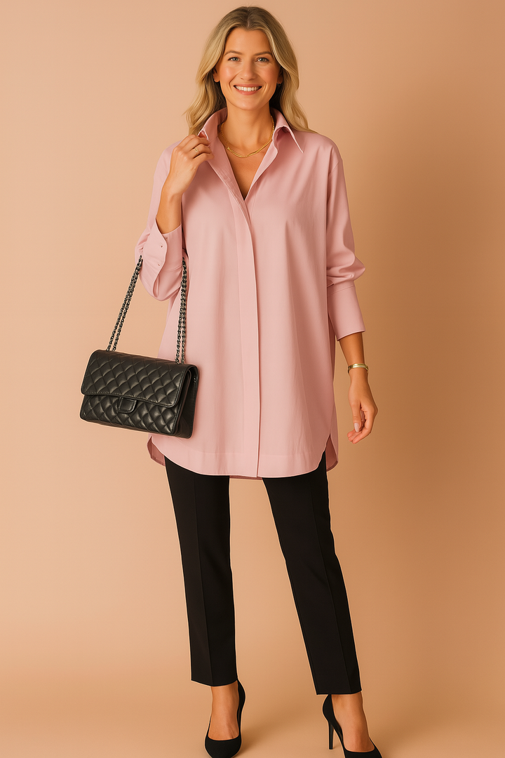 Modern women's oversized blouse with long sleeves & button-up. Elegant, versatile shirt for casual chic or professional wear.