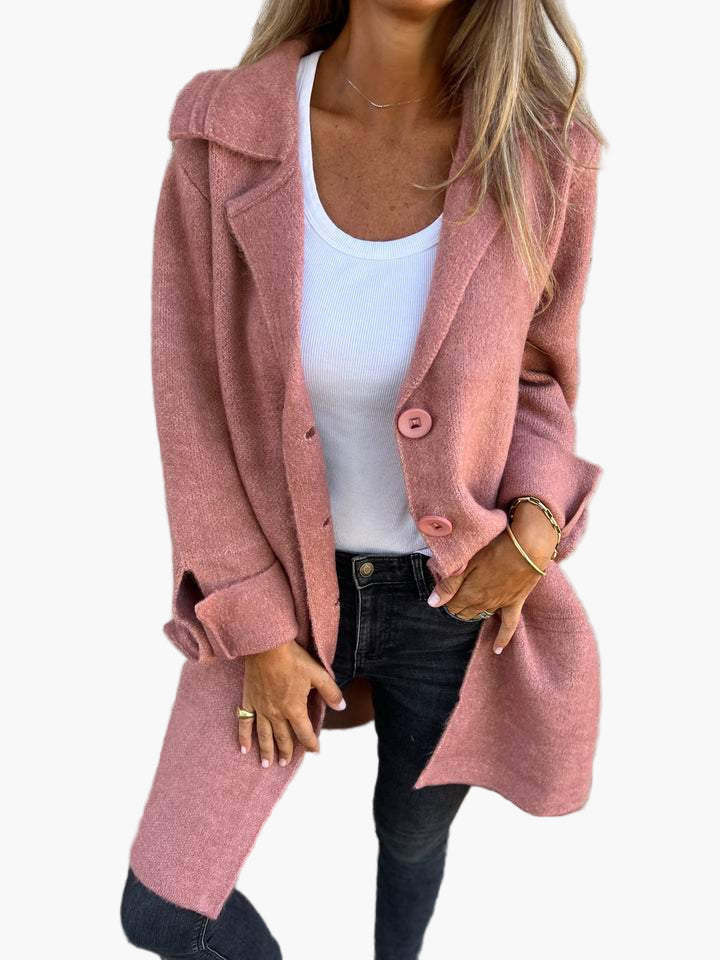 Full shot of a women's elegant oversized button-down trench coat with a structured silhouette