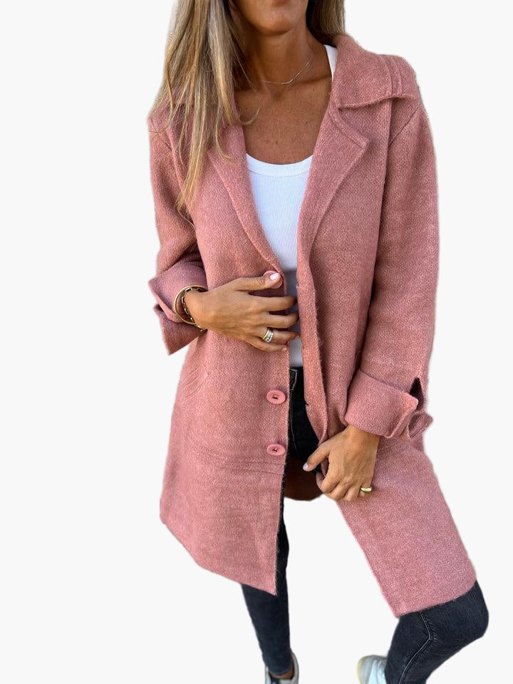 Cozy women's oversized trench coat with a classic button-down front, suitable for outerwear