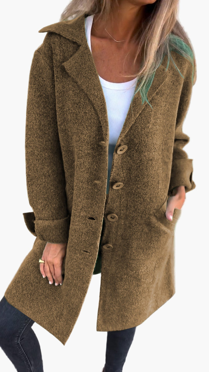 Casual yet chic women's oversized trench coat with prominent button details for fall fashion