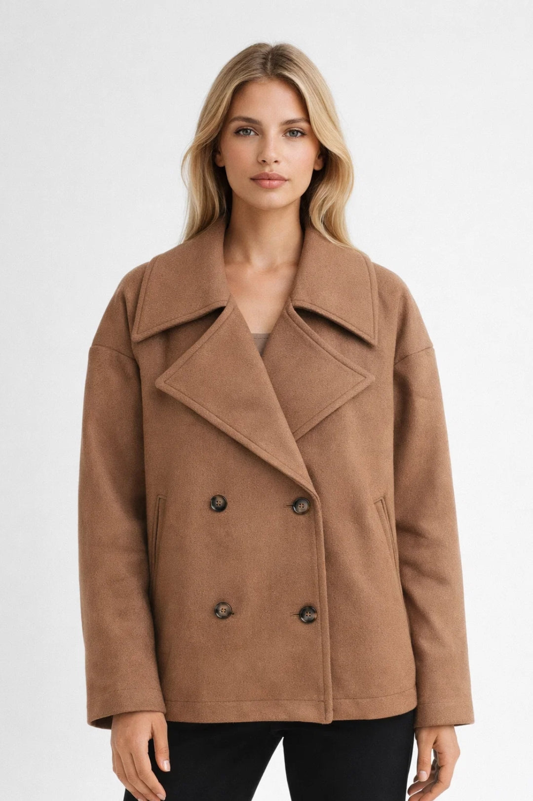 Elegant women's oversized double-breasted short coat for smart casual wear. Classic outerwear fashion.