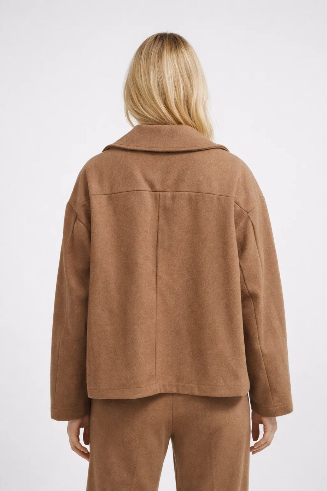 Modern classic women's oversized short coat, double-breasted outerwear jacket for elegant smart casual style.