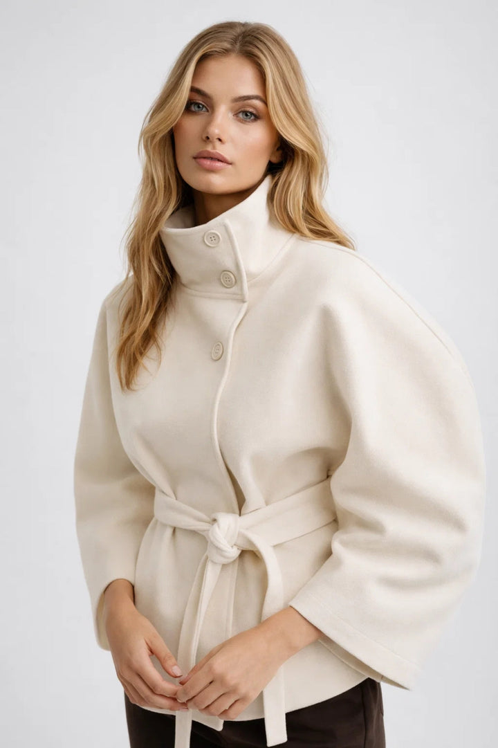 Chic women's oversized short coat featuring a sophisticated high collar and flattering belt, perfect for modern style.