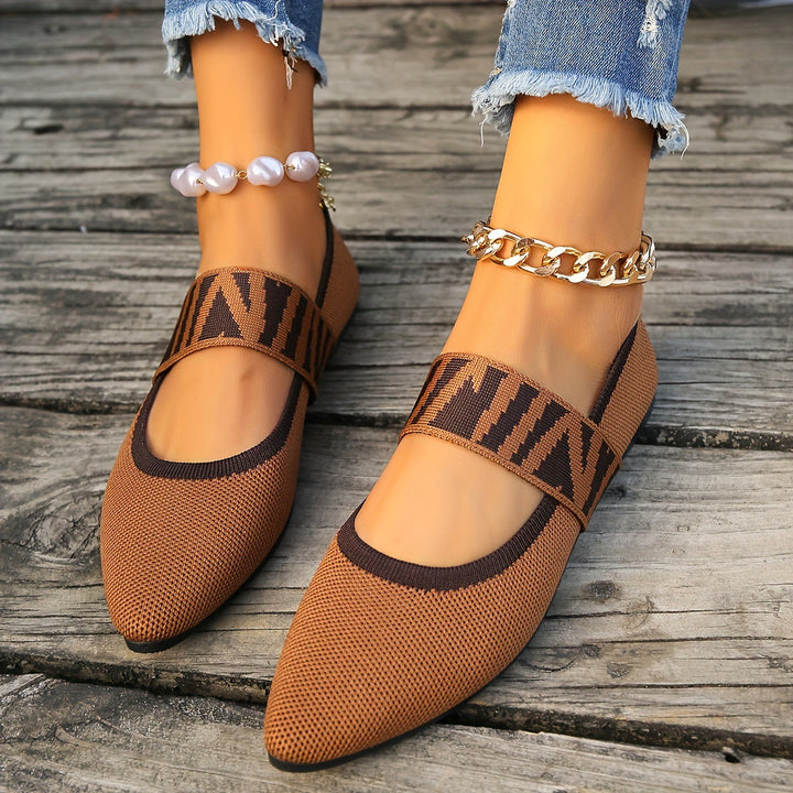 Close-up of women's patterned pointed toe ballet flats, comfortable design