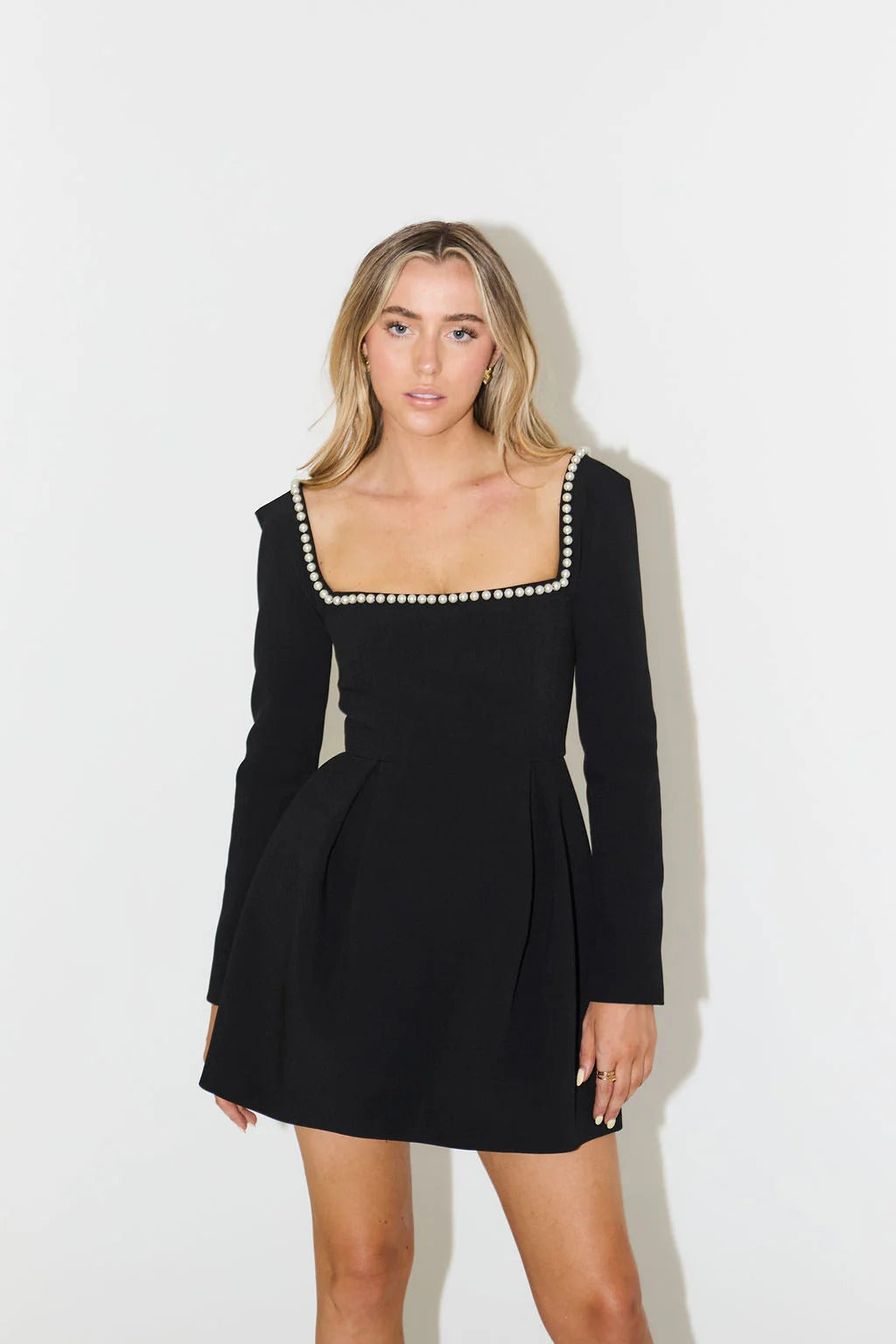 Elegant women's pearl trim long sleeve mini cocktail dress for special occasions & evening parties.