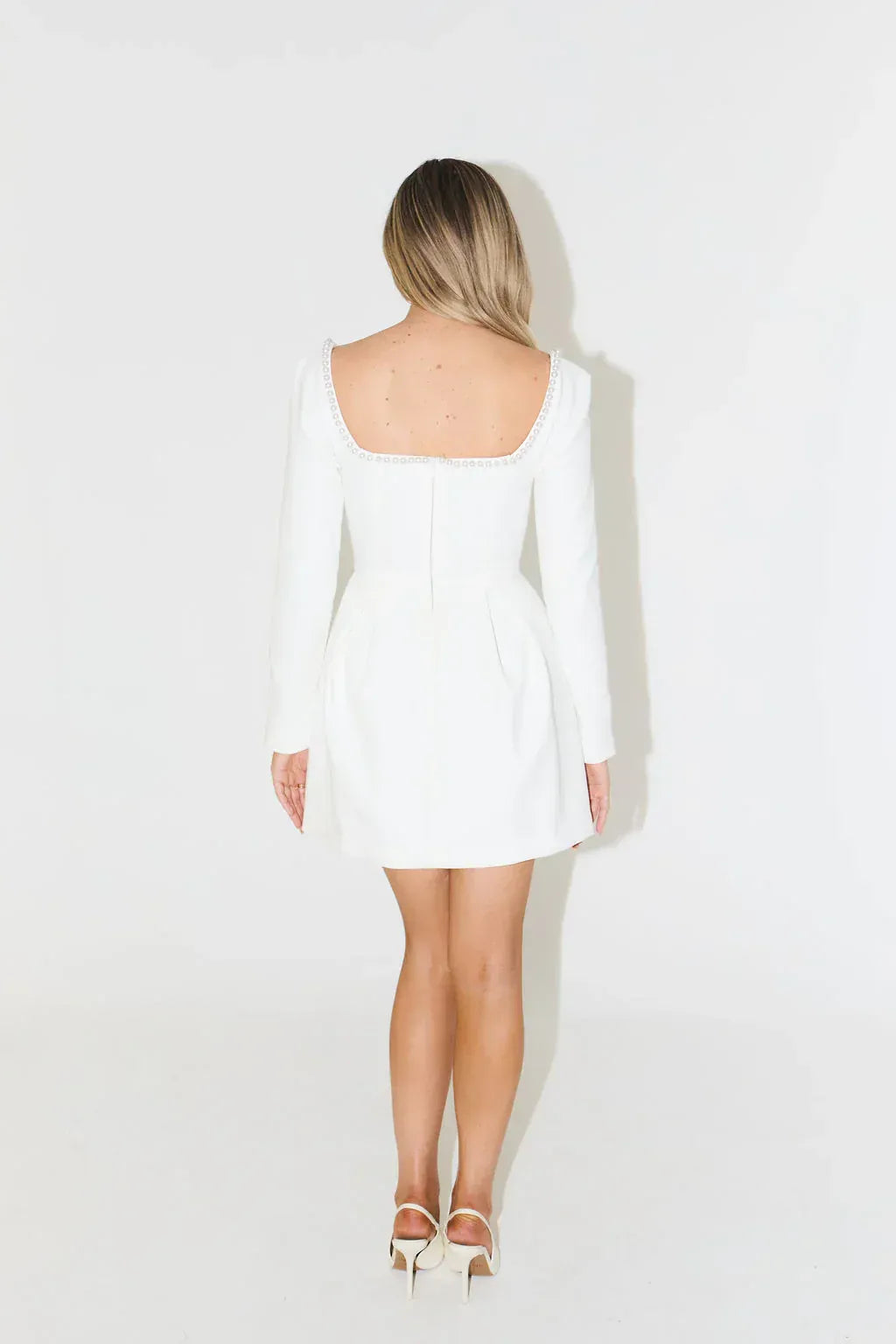 Elegant women's long sleeve pearl trim mini dress, an ideal choice for cocktail or evening parties.
