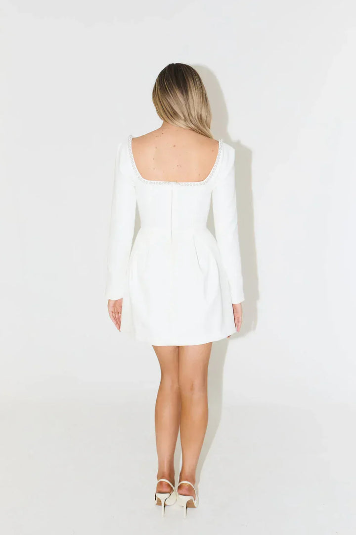 Elegant women's long sleeve pearl trim mini dress, an ideal choice for cocktail or evening parties.