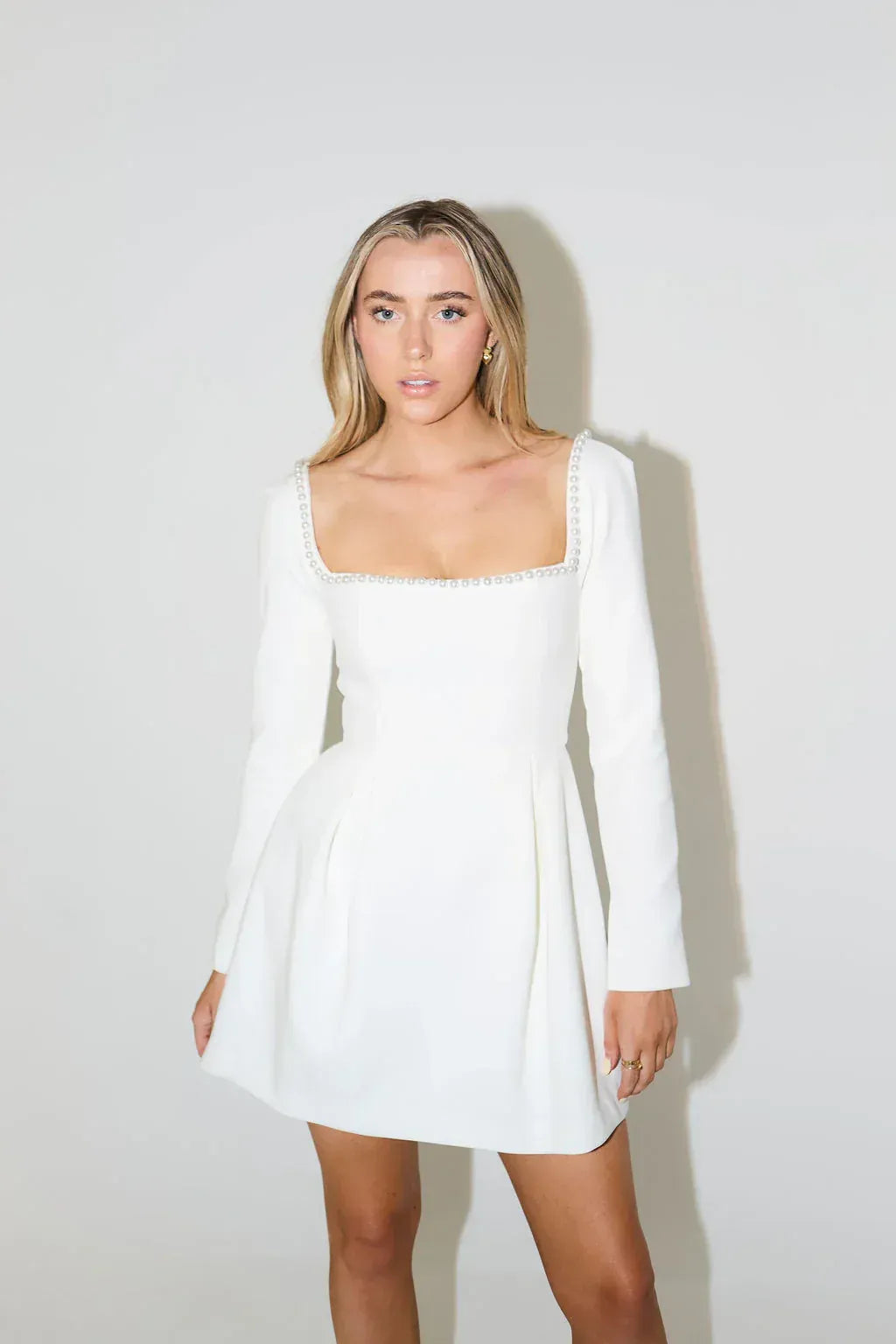 Fashionable women's pearl trim long sleeve mini dress with a square neck, great for special events.