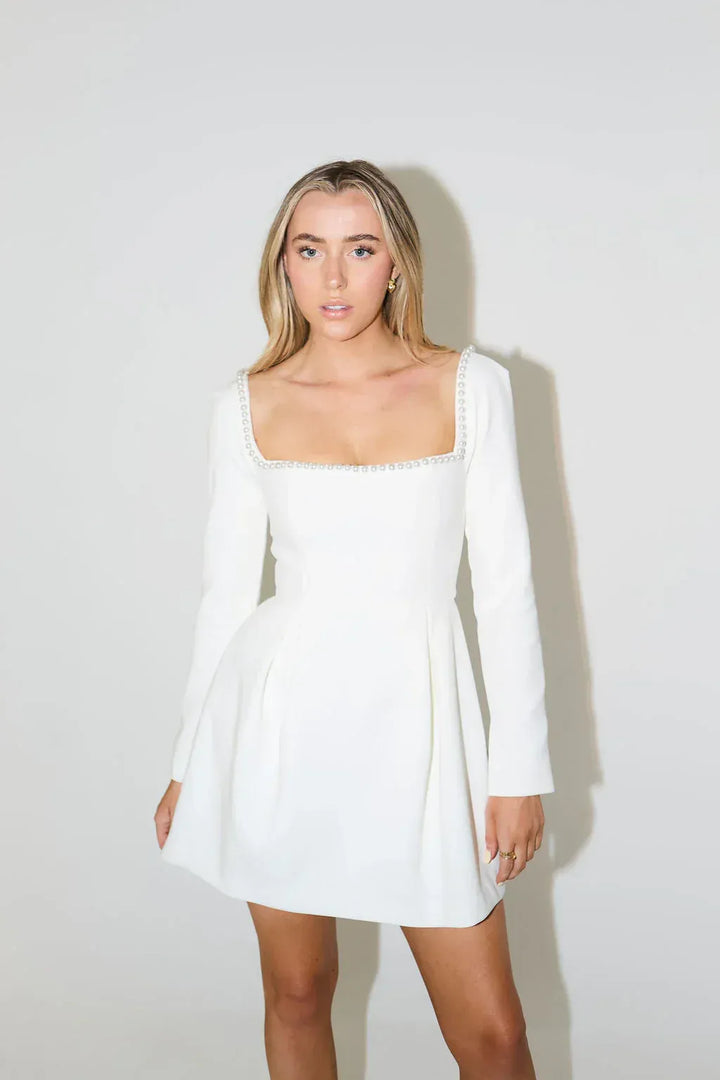 Fashionable women's pearl trim long sleeve mini dress with a square neck, great for special events.