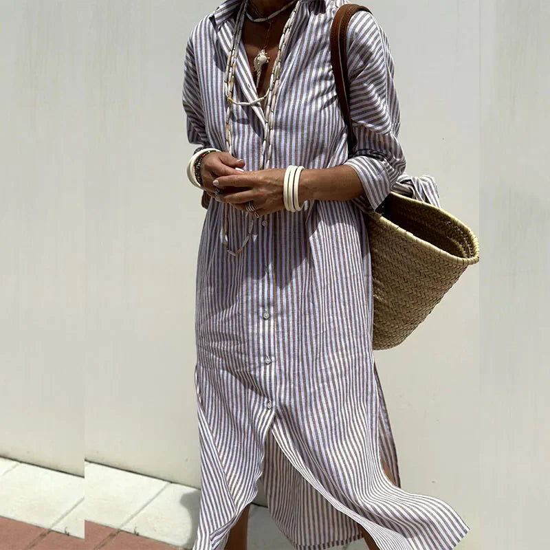 Back view of a blue elegant women's maxi summer dress, highlighting the flowy design and casual style