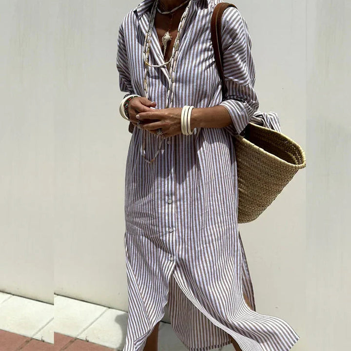 Back view of a blue elegant women's maxi summer dress, highlighting the flowy design and casual style