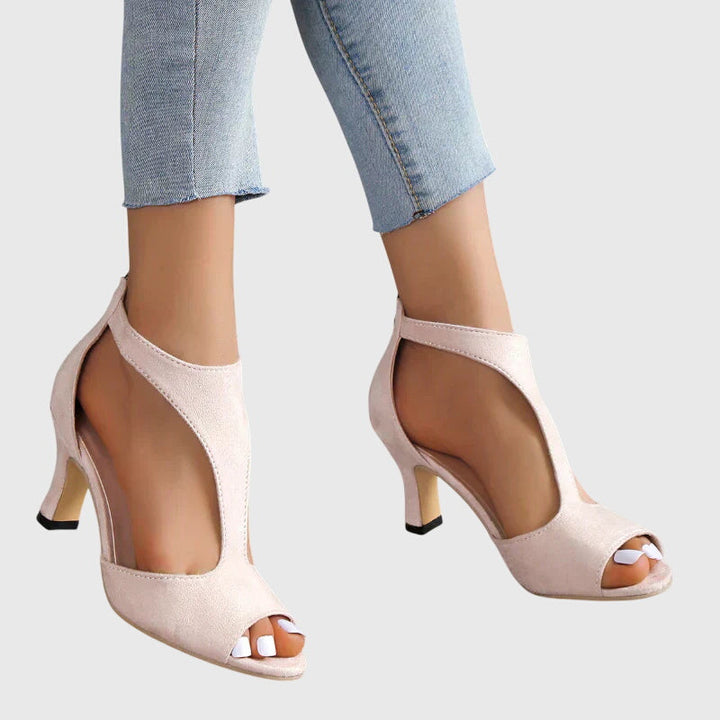 Black strappy open toe stiletto heels, a versatile and elegant choice for women's party footwear.