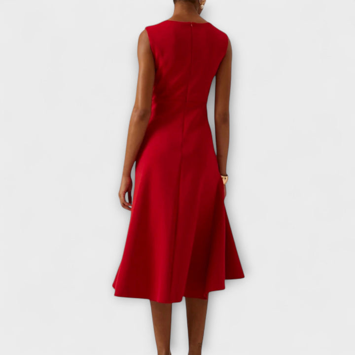 Sleeveless pleated midi dress for women, featuring a chic asymmetrical hemline, casual or party wear