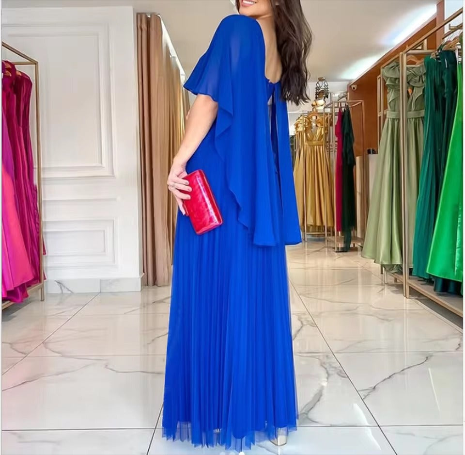 Women's formal cape gown featuring delicate pleats and a graceful, floor-length design.