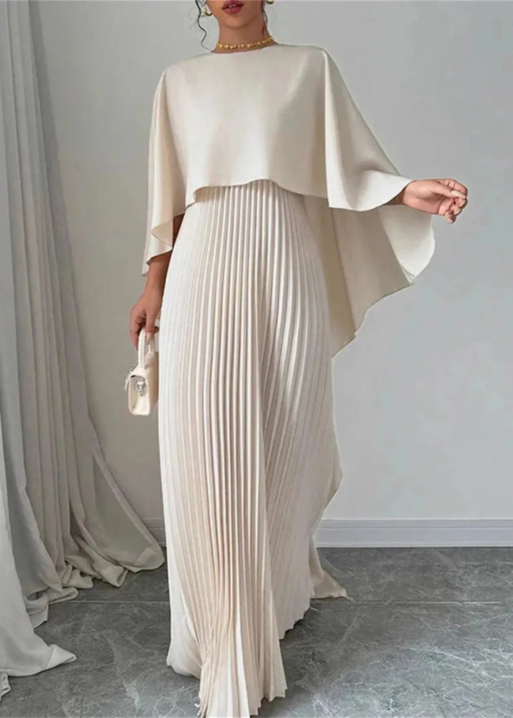 Elegant women's pleated cape maxi dress, perfect for wedding guests, in a flowing formal style.