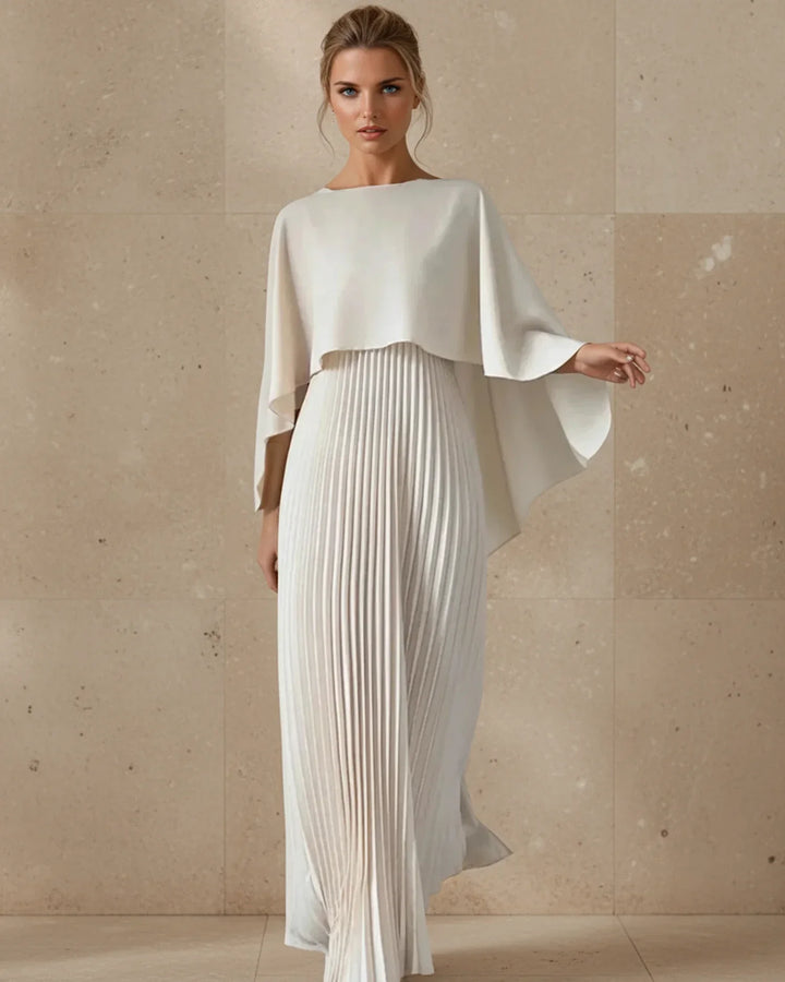 Elegant women's pleated cape maxi dress, perfect for wedding guests or formal evening events. Flowing design.