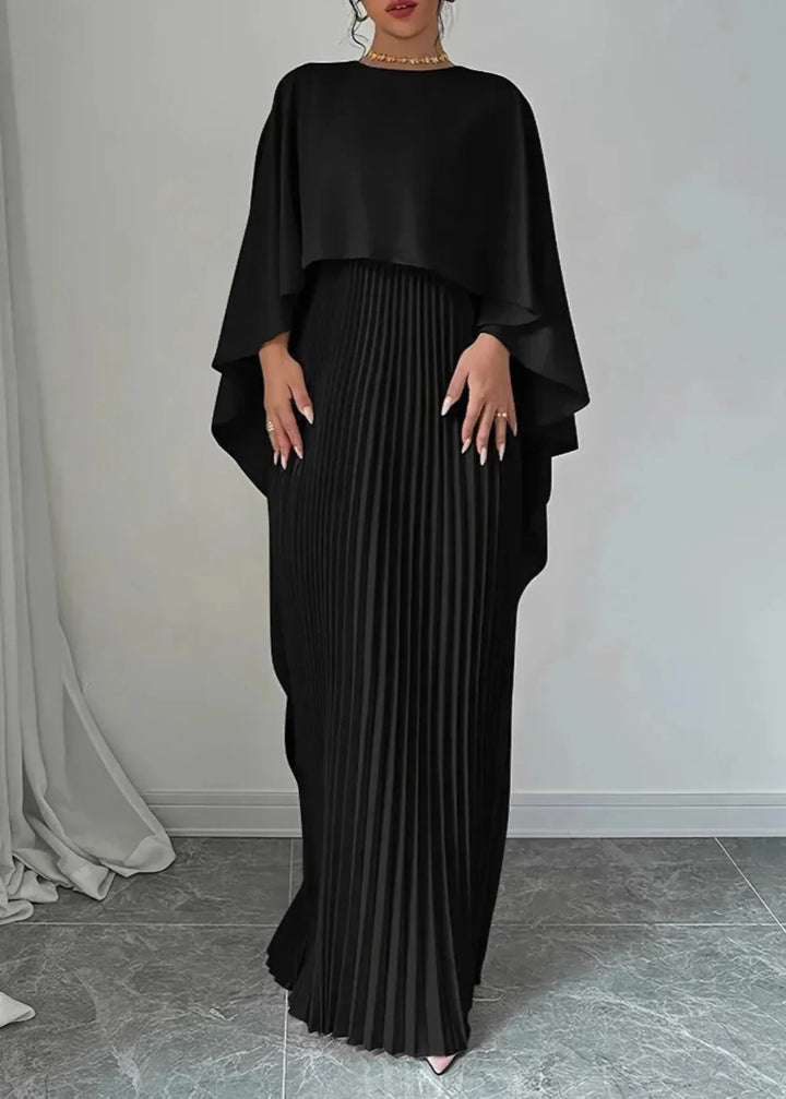 Stunning pleated maxi dress with a sophisticated cape overlay. Ideal formal wear for elegant evening and special events.