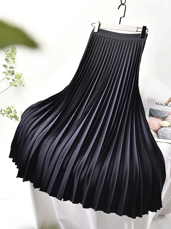 Flowy pleated maxi skirt for women, versatile for casual or chic wear.