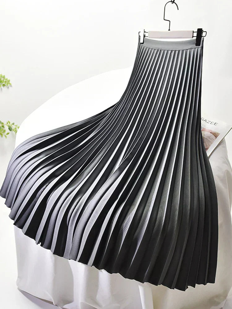 Women's long pleated skirt with elegant design, ideal for spring outfits.