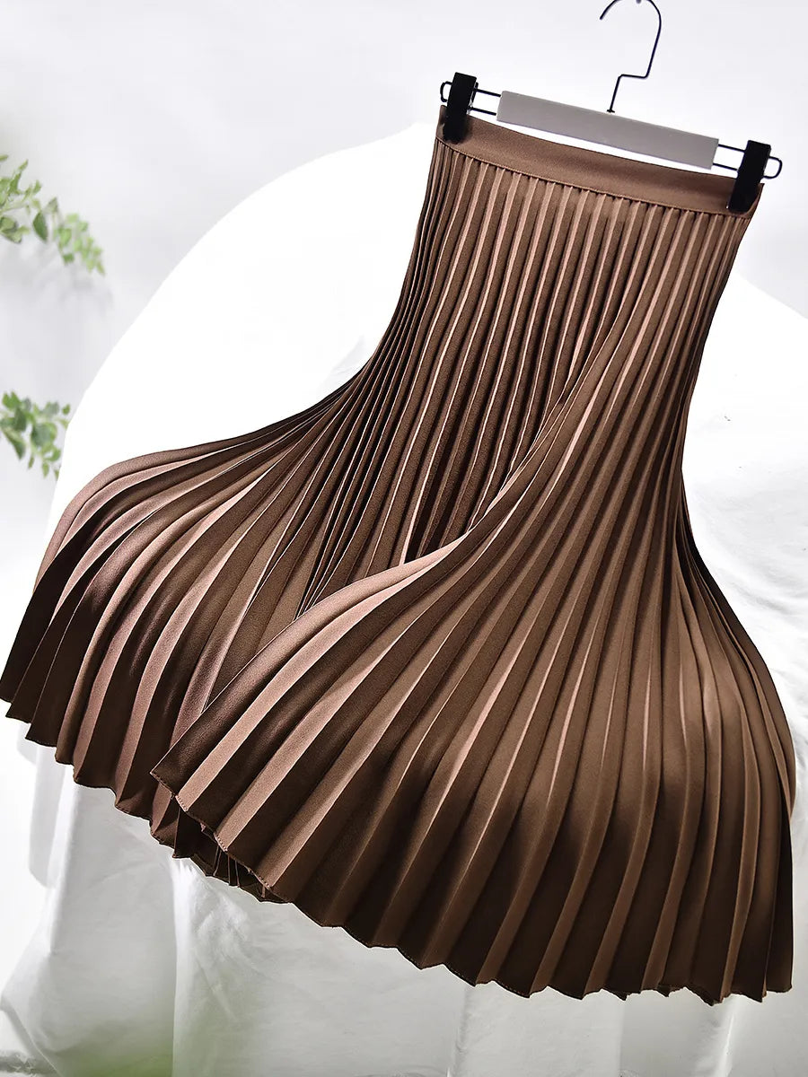 Chic pleated maxi skirt in a neutral tone, a versatile women's fashion piece.
