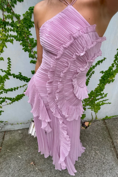 Feminine summer midi dress with pleated skirt and delicate ruffle halter neckline.