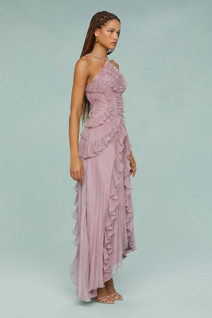 Close-up of the elegant ruffle halter on a women's pleated midi party dress.