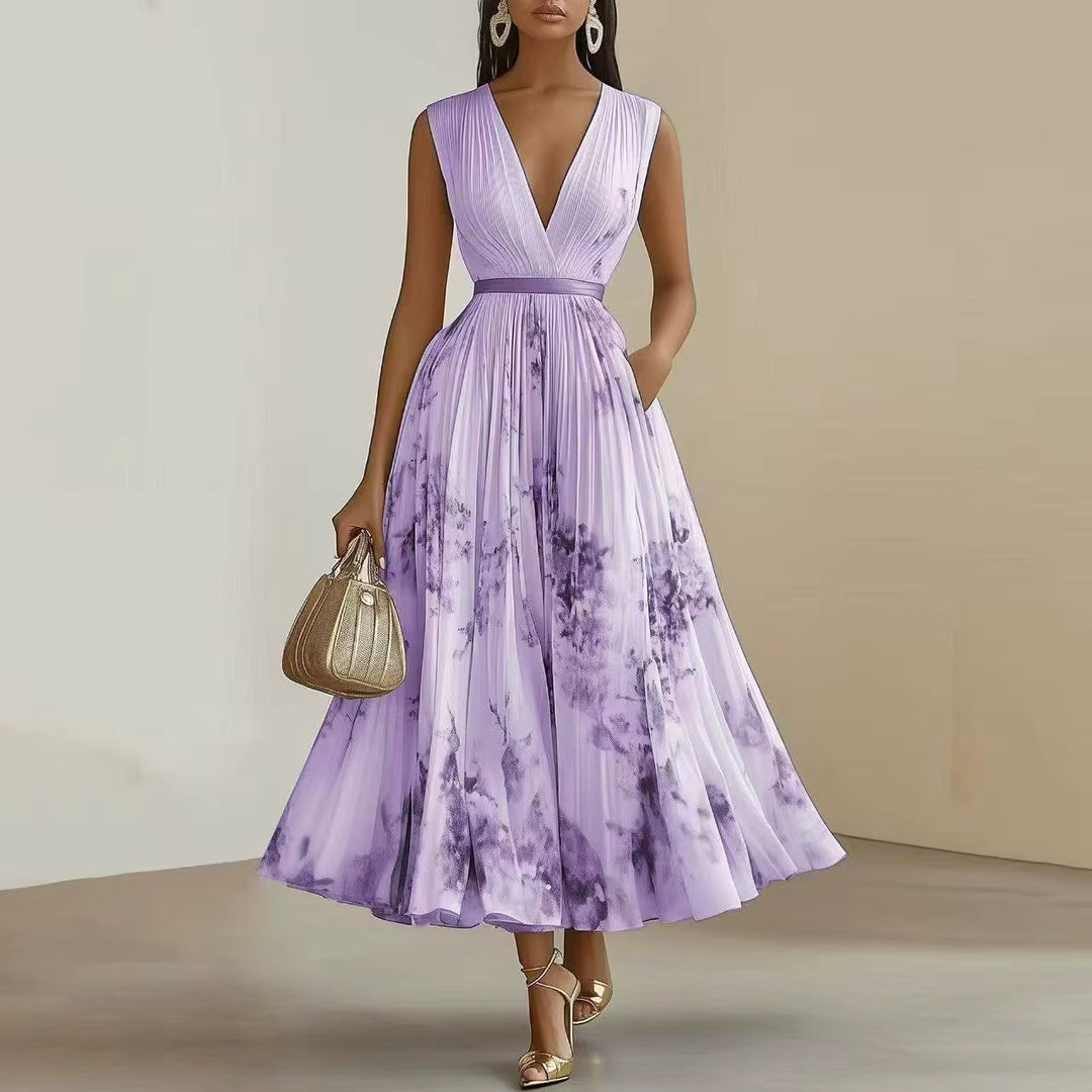 Women's elegant long sleeve maxi dress in a vibrant floral print, with a flattering V-neck and pleated design