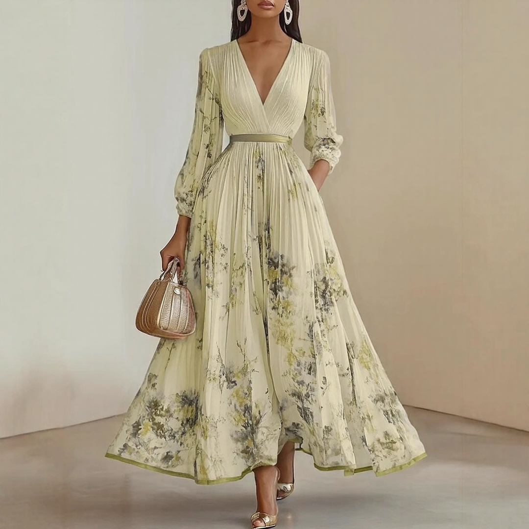 Stylish women's summer maxi dress with a V-neck, all-over floral print, and elegant pleated details