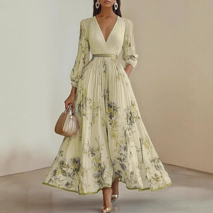 Stylish women's summer maxi dress with a V-neck, all-over floral print, and elegant pleated details