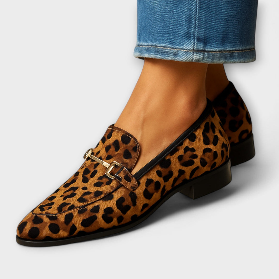 Elegant women's pointed toe animal print loafers; leopard pattern slip-ons for casual or dressy style.