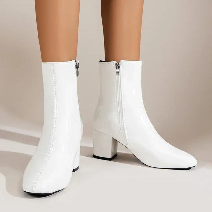 Elegant women's pointed toe ankle boots with comfortable block heel, perfect for versatile fashion.