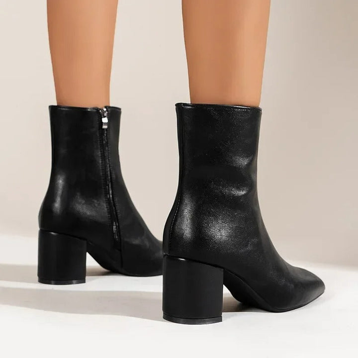 Comfortable women's pointed toe ankle boots with block heel, perfect for stylish versatile wear.
