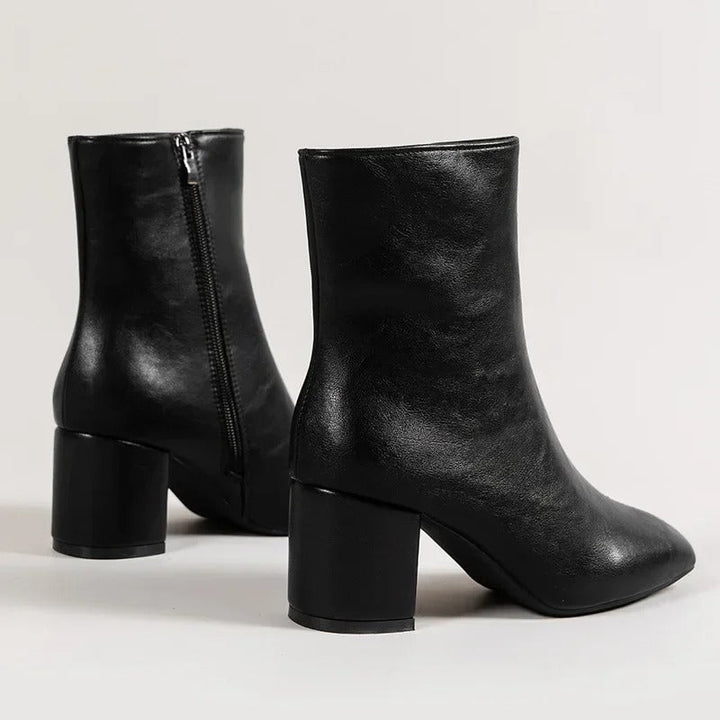 Fall fashion women's pointed toe ankle boots, elegant block heel design for chic winter outfits.