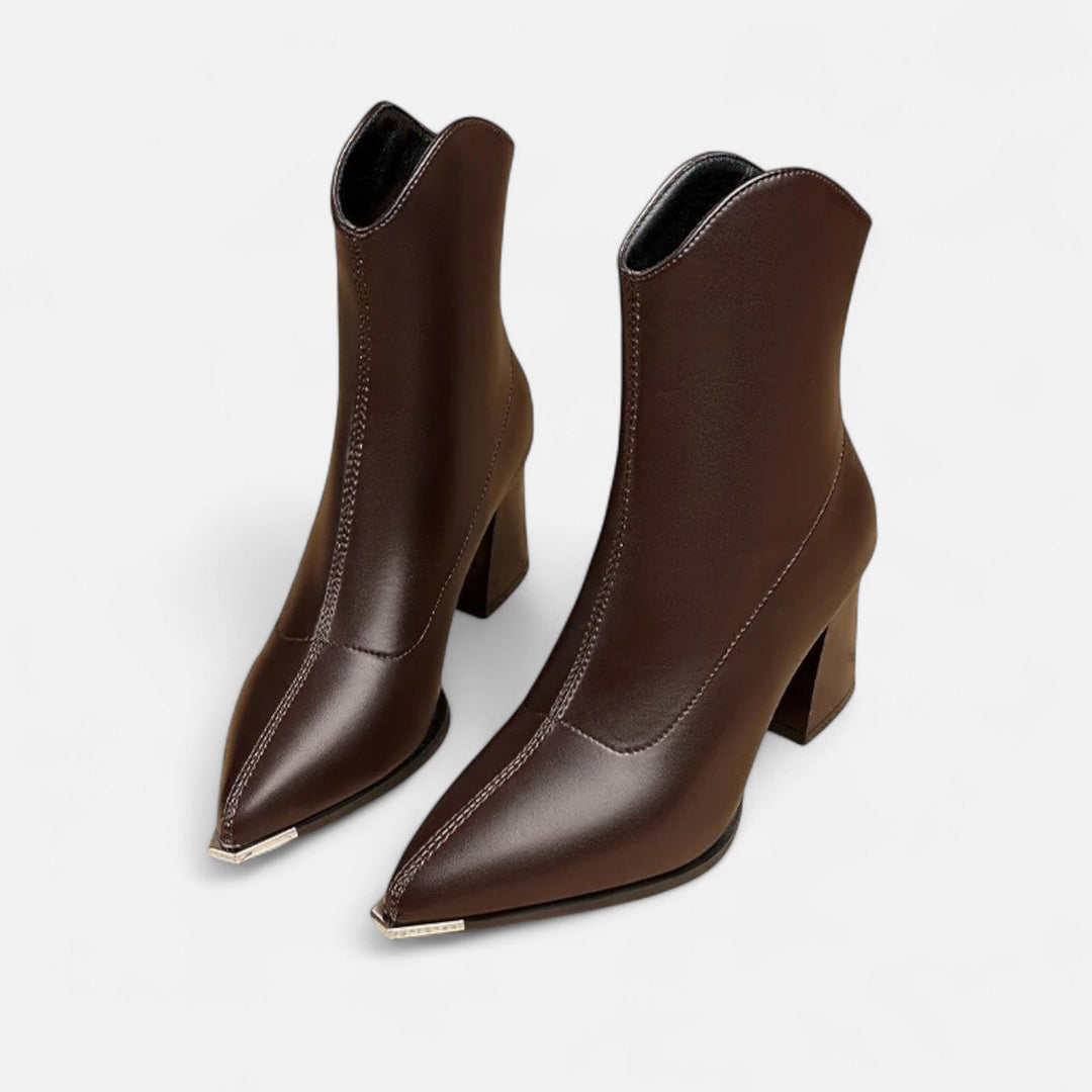 Chic women's pointed-toe Chelsea boots with elastic goring, offering elegant style and comfort. Perfect fall footwear.