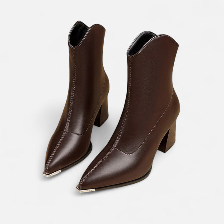 Chic women's pointed-toe Chelsea boots with elastic goring, offering elegant style and comfort. Perfect fall footwear.