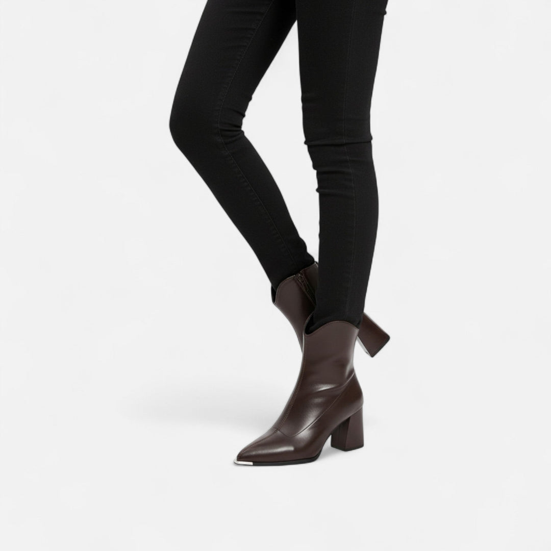 Modern women's pointed-toe Chelsea boots, a versatile classic for elegant fashion. Perfect chic ankle footwear.