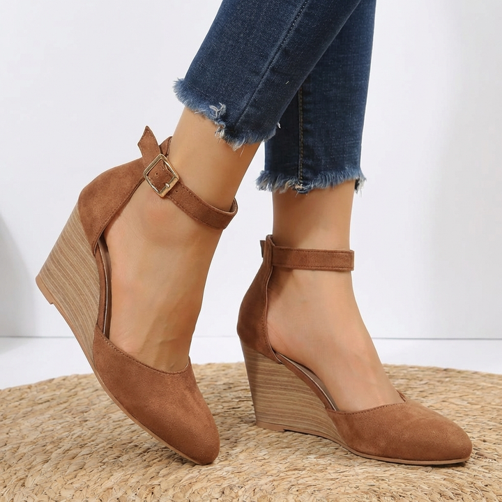 Comfortable pointed toe wedge heels for women, featuring a stylish ankle strap. Ideal for summer and casual chic.
