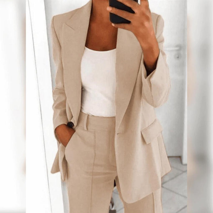 Close-up of a women's professional suit set: tailored blazer and matching pants, ideal business attire.