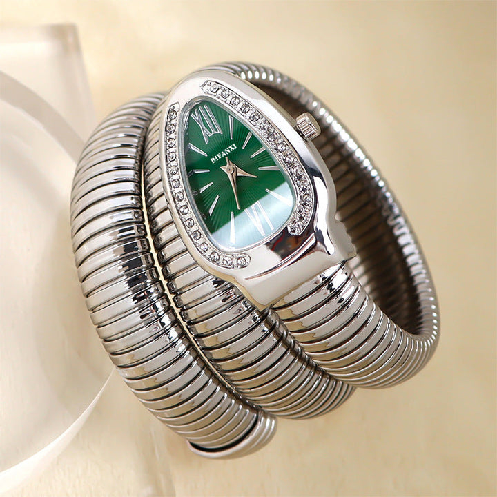 Elegant women's quartz watch with unique snake design and matching bracelet.