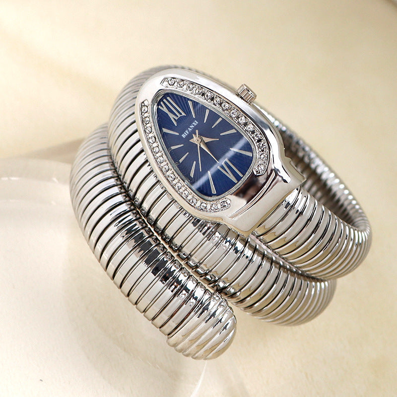 Sophisticated women's snake quartz watch & matching bracelet, a jewelry statement.
