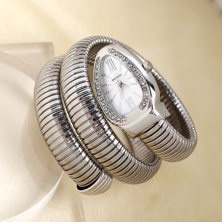 Women's designer snake quartz watch with a fashionable bracelet, an elegant accessory.