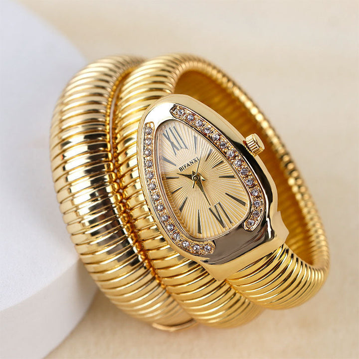 Elegant women's quartz watch, intricate snake detail & a fashionable bracelet.